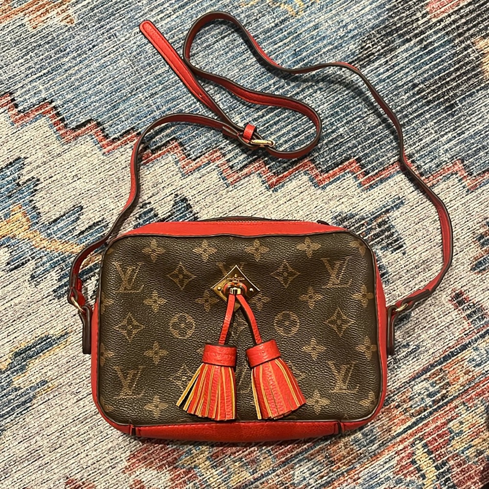 Faux Louis Vuitton cross body purse with adjustable strap and interior pocket